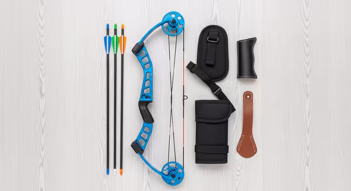 A complete youth compound bow ready-to-shoot kit laid out on a clean surface.
